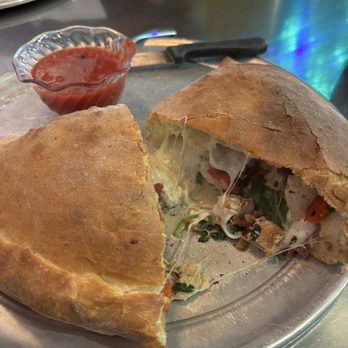 Lupi's Pizza Pies - chicken carbonara Calzone, cut open - Pizza Near Me - Cleveland, Tennessee Lupi's Pizza Pies - chicken carbonara Calzone, cut open - Pizza Near Me - Cleveland, Tennessee