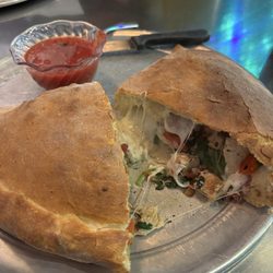 Lupi's Pizza Pies - Chicken carbonara Calzone, cut open