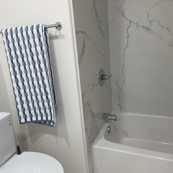 Fo Remodeling - New tub, toilet, quartz counter and new tile floor. - General Contractors Near Me - Elk Grove, California