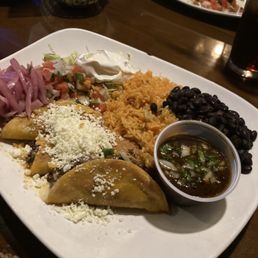 Birria tacos with black beans and rice and a little au jus. Amazing! Birria tacos with black beans and rice and a little au jus. Amazing!