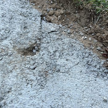 Roman Construction and Landscaping - Same section cracking and 1inch hole. - Landscaping Near Me