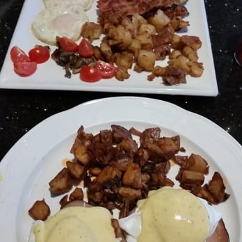 Bellagio Cafe - To plate is Full Bellagio Breakfast  And bottom is Eggs Benedict with ham. - Italian Near Me - Vancouver, British Columbia