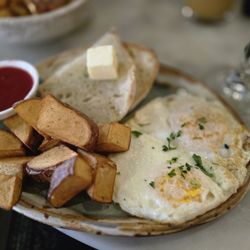 Ivy Café - 2 eggs over medium Potatoes Sourdough bread Jam