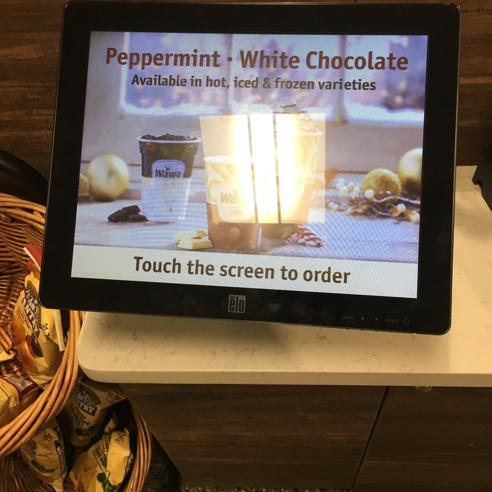 Wawa - a screen displaying a menu for peppermint white chocolate - Convenience Stores Near Me - Bryn Mawr, Pennsylvania Wawa - a screen displaying a menu for peppermint white chocolate - Convenience Stores Near Me - Bryn Mawr, Pennsylvania
