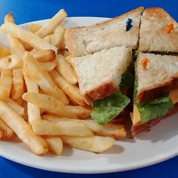 Landmark Coffee Shop - Triple-decker sandwich of corn beef, American cheese, mustard, on white bread, and French fries. - Coffee & Tea Near Me - New York, New York