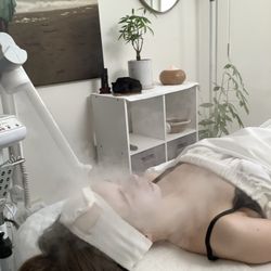 Freddy Fox Face Total Skincare - Client enjoying an exfoliating mask with steam prior to extractions