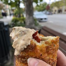 Budapest Bakeshop - Eating a delicious Hungarian sausage