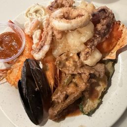 Mussels, overcooked salmon, soggy fried squid, (tasted like) last week's fried shrimp, horrible stuffed jalapeño, prawns