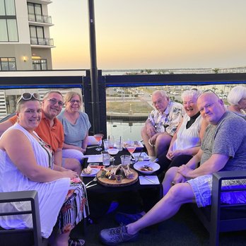Rooftop Sky Bar - Note the short table- a COFFEE table for six people where we had a $300 minimum so we were expected to eat a meal on a coffee table?! - Cocktail Bars Near Me - Fort Myers, Florida Rooftop Sky Bar - Note the short table- a COFFEE table for six people where we had a $300 minimum so we were expected to eat a meal on a coffee table?! - Cocktail Bars Near Me - Fort Myers, Florida