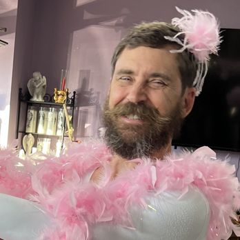 Romulus Flowers & Gifts - Bearded Ballerina looking way too pleased with himself in his feathered glory. That smile says, 'Maybe I was born for this.'  pink tutu - Florists Near Me - Romulus, Michigan