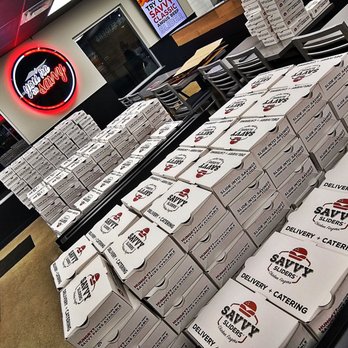 Savvy Sliders - stacks of boxes of pizza - Burgers Near Me - Lincoln Park, Michigan