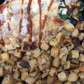 Brunch Cafe-Niles - Garden omelette with diced potatoes. I added some siracha sauce on top. - Breakfast & Brunch Near Me - Niles, Illinois