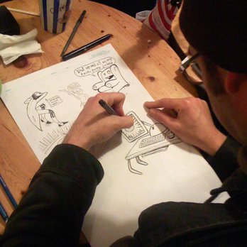 Muddy Waters Coffee House - An artist works on a jam comic at Muddy Waters - Coffee & Tea Near Me - San Francisco, California