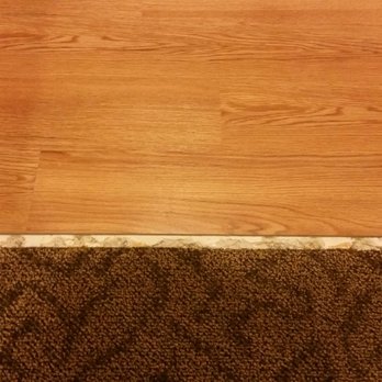 Best Carpet - a close up of a wood floor - Carpeting Near Me - Greenfield, Wisconsin Best Carpet - a close up of a wood floor - Carpeting Near Me - Greenfield, Wisconsin
