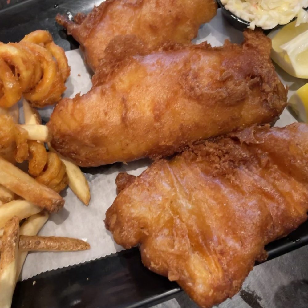The fish comes with fries. You can upgrade to curly fries for a small fee. The fish comes with fries. You can upgrade to curly fries for a small fee.