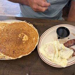 Short stack - Pancakes over easy eggs and bacon.