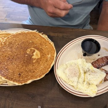 Caroline's Omelet House - Short stack - Pancakes over easy eggs and bacon. - Breakfast & Brunch Near Me - Ogallala, Nebraska