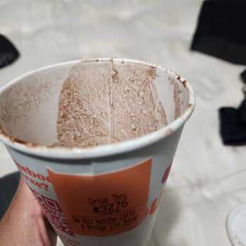 Dunkin' - a person holding a cup of ice cream - Coffee & Tea Near Me - Wyoming, Michigan Dunkin' - a person holding a cup of ice cream - Coffee & Tea Near Me - Wyoming, Michigan