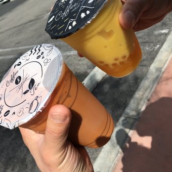 Formosa Tea Time - Mango smoothie with dairy free creamer w/mango popping boba and mango jelly (black lid), and the tiger milk tea (white lid) - Coffee & Tea Near Me - Anaheim, California