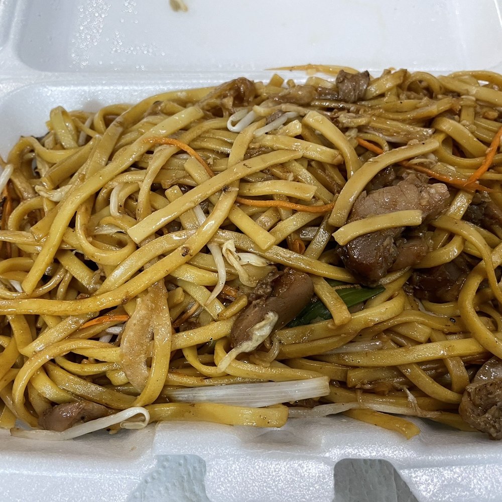 noodles and meat in a styrofoam container