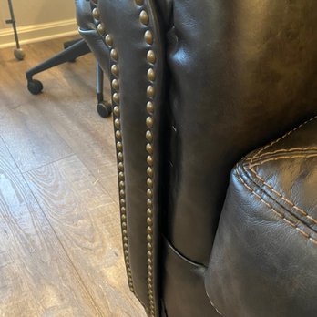 Ashley Store - Tech installed staples where they can be seen and cap piece is not installed correctly as it shown in other photo. - Furniture Stores Near Me - Falls Church, Virginia Ashley Store - Tech installed staples where they can be seen and cap piece is not installed correctly as it shown in other photo. - Furniture Stores Near Me - Falls Church, Virginia