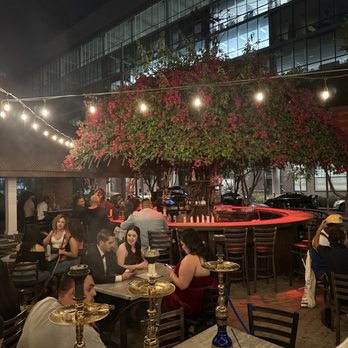 Samsara - a group of people sitting at tables outside at night - Hookah Bars Near Me - Phoenix, Arizona Samsara - a group of people sitting at tables outside at night - Hookah Bars Near Me - Phoenix, Arizona