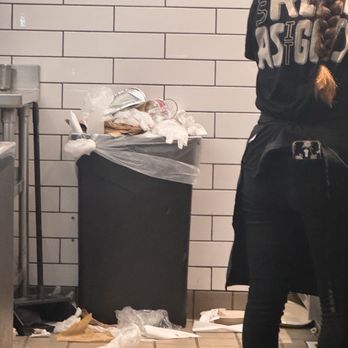 Chipotle Mexican Grill - Garbage behind the counter in the food prep area. - Fast Food Near Me - Milford, Massachusetts