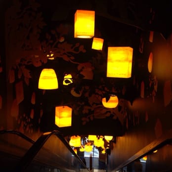 Disney Store - Staircase from 2nd story decorated from a scene from Tangled with floating lanterns - Toy Stores Near Me - New York, New York Disney Store - Staircase from 2nd story decorated from a scene from Tangled with floating lanterns - Toy Stores Near Me - New York, New York