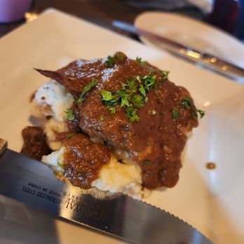 Laci's Tapas Bar - a plate of meat and mashed potatoes - Tapas/Small Plates Near Me - Syracuse, New York