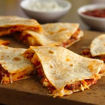 Tommy's Pizza - four quesadillas on a cutting board - Pizza Near Me - Philadelphia, Pennsylvania Tommy's Pizza - four quesadillas on a cutting board - Pizza Near Me - Philadelphia, Pennsylvania