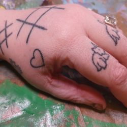 Healed hand tattoos