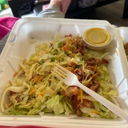 Grilled Chicken Salad. The salad is yellow and the honey mustard dressing is yellow water with no flavor.