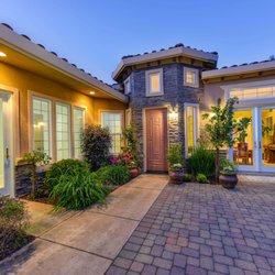 Royal Lawn Maintainance - Home in gated community with lots of small planters requiring meticulous maintenance and care.