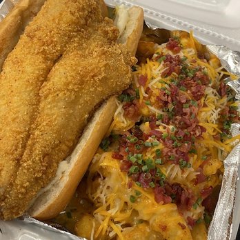 Midnight Munchies - Fried catfish poboy with loaded fries. - Seafood Near Me - Baton Rouge, Louisiana
