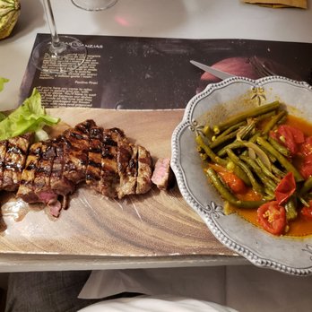 Anticas Licanzias - Sliced steak using local Sardinian beef, along with a side of beans and tomatoes. Pretty solid. - Coffee & Tea Near Me - Olbia, OT