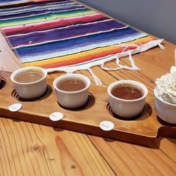 Kakawa Chocolate House - Hot chocolate flight, plus whipped cream. We ordered American, Chai, Tzul and chili flavors.