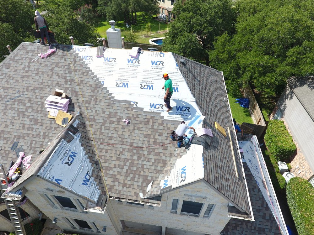 Slide of Ultimate Roofing Company