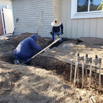 EC Irrigation Repair - The team trenching to relocate irrigation. Tons of weeds to get through, and delicately! - Irrigation Near Me