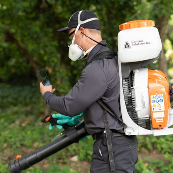 Hawx Pest Control - Hawx technician with backpack fogger and mask ensures safe, effective outdoor pest control service. - Pest Control Near Me - West Chicago, Illinois