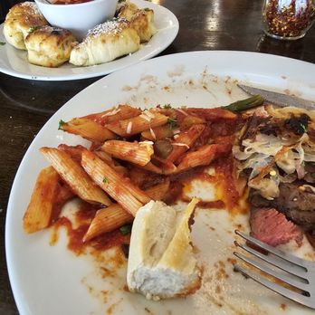Zeffiro's Pizzeria Downtown - Iron Flat steak and penne pasta with marinara sauce and garlic melts. - Pizza Near Me - Las Cruces, New Mexico Zeffiro's Pizzeria Downtown - Iron Flat steak and penne pasta with marinara sauce and garlic melts. - Pizza Near Me - Las Cruces, New Mexico
