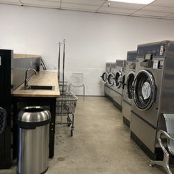 Four sizes of washing machines, counter space to fold, sink, plenty of carts to help move laundry around.