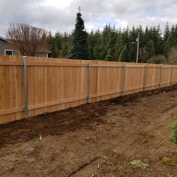 DM Fencing - 5 ft Cedar fence with metal post (back) - Fences & Gates Near Me