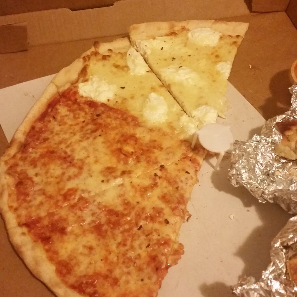 Pizza Village Cafe II - Half plain half white half eaten pizza lol those are garlic knots on the side - Pizza Near Me - Belleville, New Jersey Pizza Village Cafe II - Half plain half white half eaten pizza lol those are garlic knots on the side - Pizza Near Me - Belleville, New Jersey
