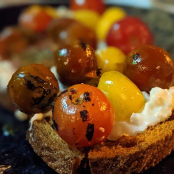 Italian Kitchen - a piece of bread with tomatoes and cheese - Italian Near Me - Vancouver, British Columbia