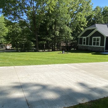 Greenop's Lawn & Landscapes - a driveway and a house - Landscaping Near Me - Rockford, Michigan Greenop's Lawn & Landscapes - a driveway and a house - Landscaping Near Me - Rockford, Michigan