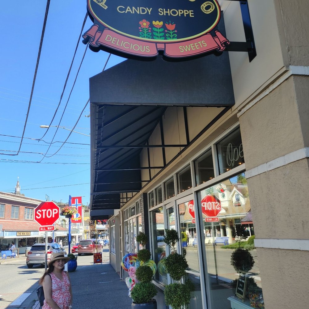 Poulsbo Candy Shoppe - a woman walking her dog - Candy Stores Near Me - Poulsbo, Washington Poulsbo Candy Shoppe - a woman walking her dog - Candy Stores Near Me - Poulsbo, Washington
