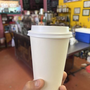 Rael's - a hand holding a cup of coffee - Cafes Near Me - Questa, New Mexico