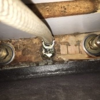 Kitchen Mart - The dry rot under the kitchen sink because the faucet was improperly tightened and caulk was used instead of putty. - General Contractors Near Me - Sacramento, California