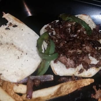 Hickory Tavern - This burnt hot mess of a "cheesesteak" is a returning favorite?  LIES!  Charred & inedible. - Sports Bars Near Me - Indian Trail, North Carolina