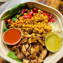 Chicken Tostada Bowl -- Organic Spinach, Kale, Cilantro, Tomato, Roasted Corn, Feta, Blackened Chicken Thighs , Lime Cilantro Vinaigrette Chicken Tostada Bowl -- Organic Spinach, Kale, Cilantro, Tomato, Roasted Corn, Feta, Blackened Chicken Thighs , Lime Cilantro Vinaigrette